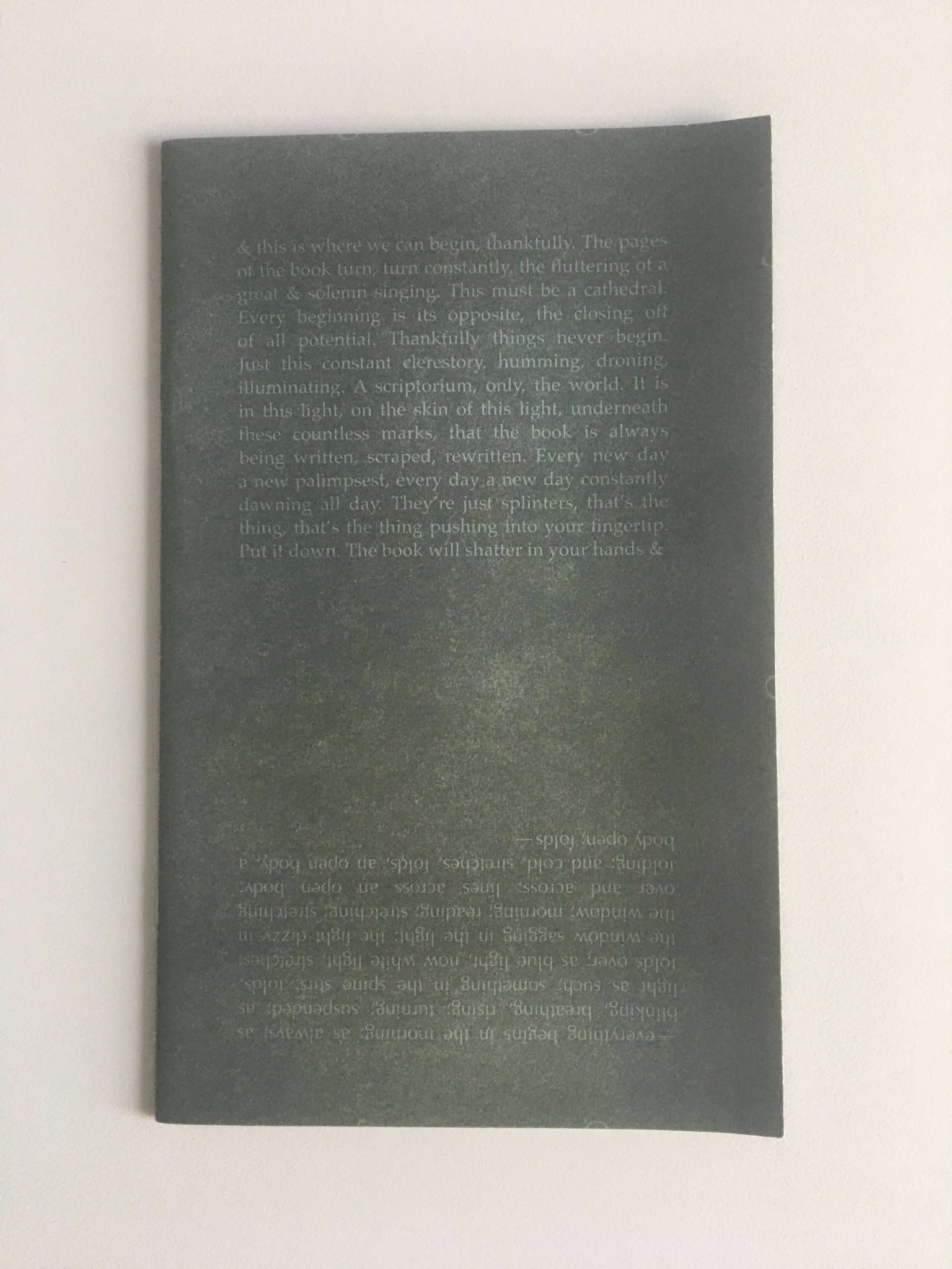 The front cover of Clerestory, which contains text in a vertically mirrored orientation against a dark background.